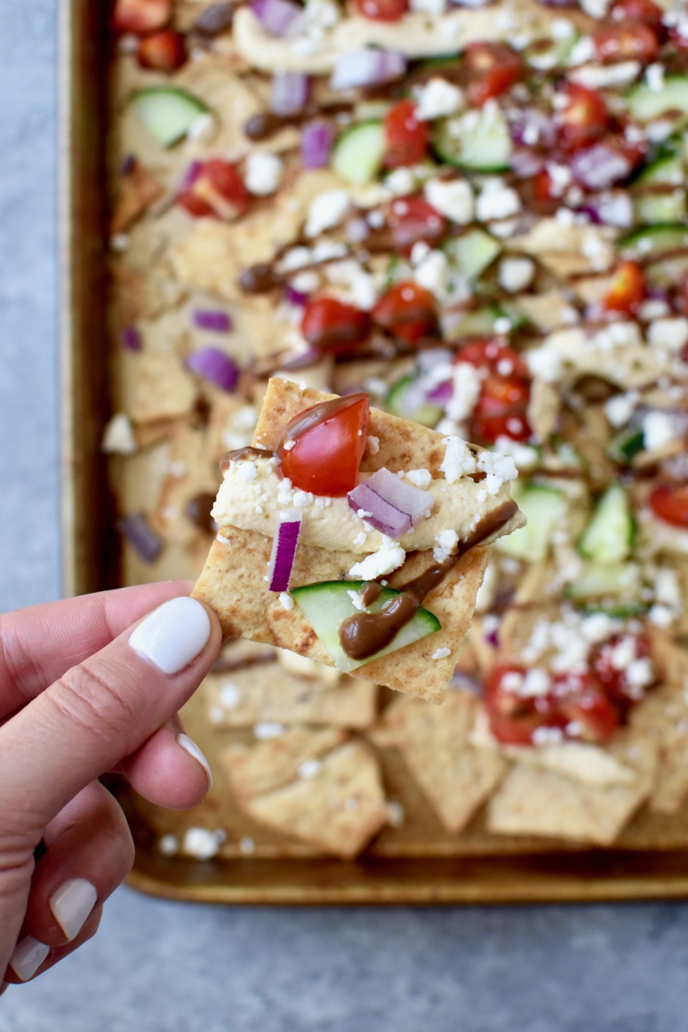 greek pita chip nachos - a quick and easy meal solution everyone will love! // cait's plate